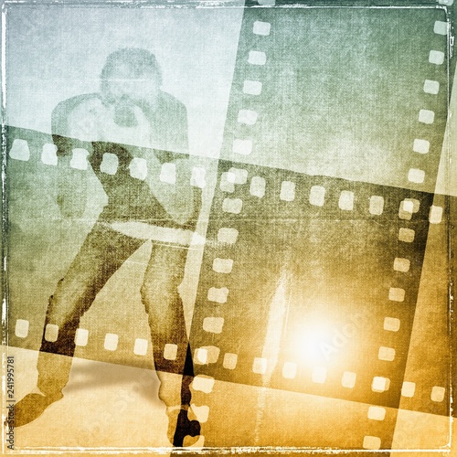 Vintage sepia film strip frame with unrecognizable  figure of photographer at work.