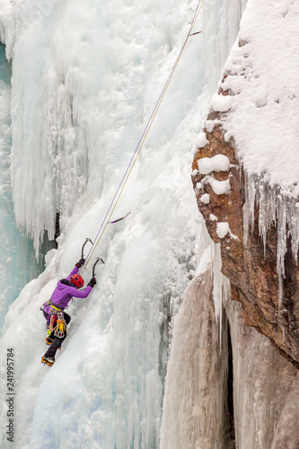 Ice Climber Ascending Waterfall Ice