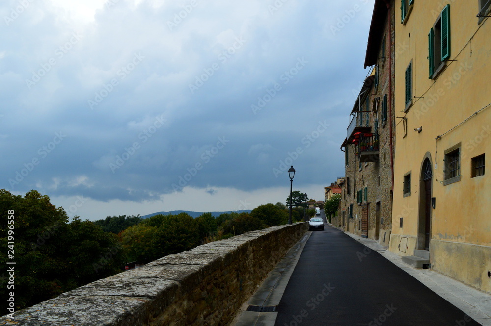 Street along the city walls with horizon view, Italy
