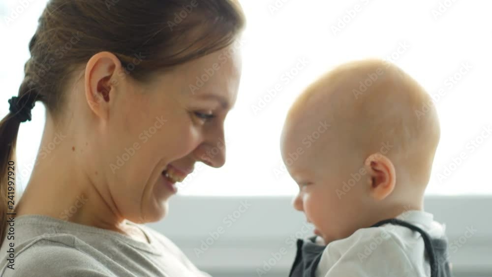 Mother and Baby. Happy Family. Mom With her Child smiling and laughing at home. Mother and Baby. Happy Family. Mom With her Child smiling and laughing at home.