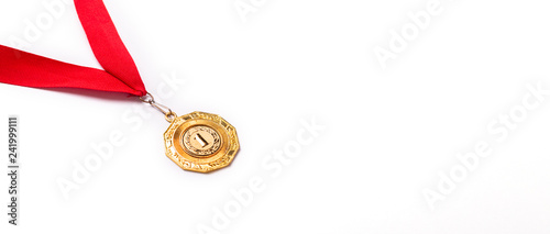 Gold medal with red ribbon on white background. Isolated. Copy space