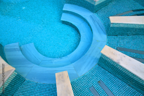 Descent to the pool made in shape of a semicircle