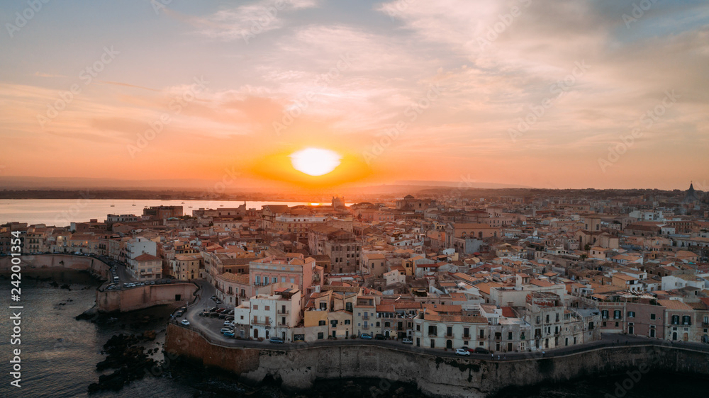 Aerial panoramic view of Ortigia island,old town of Syracuse.Small island on Sicily,Italy.Sicilian vacation,charming Italian experience.Beautiful seaside landscape