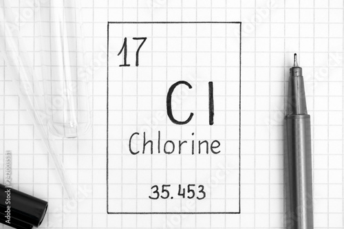 Handwriting chemical element Chlorine Cl with black pen, test tube and pipette.