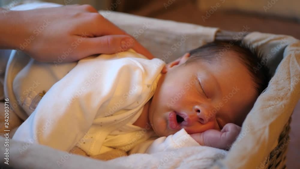 adorable sleeping infant baby getting soft touch by mother adorable sleeping infant baby getting soft touch by mother