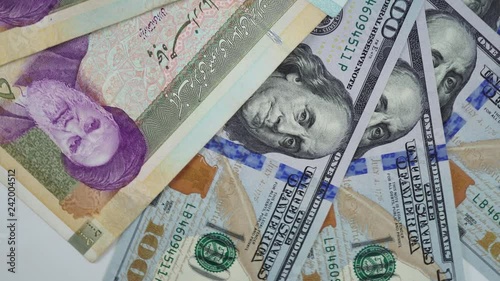 US dollar and Iranian rial. Portrait of Khomeini on Iranian money. 4K