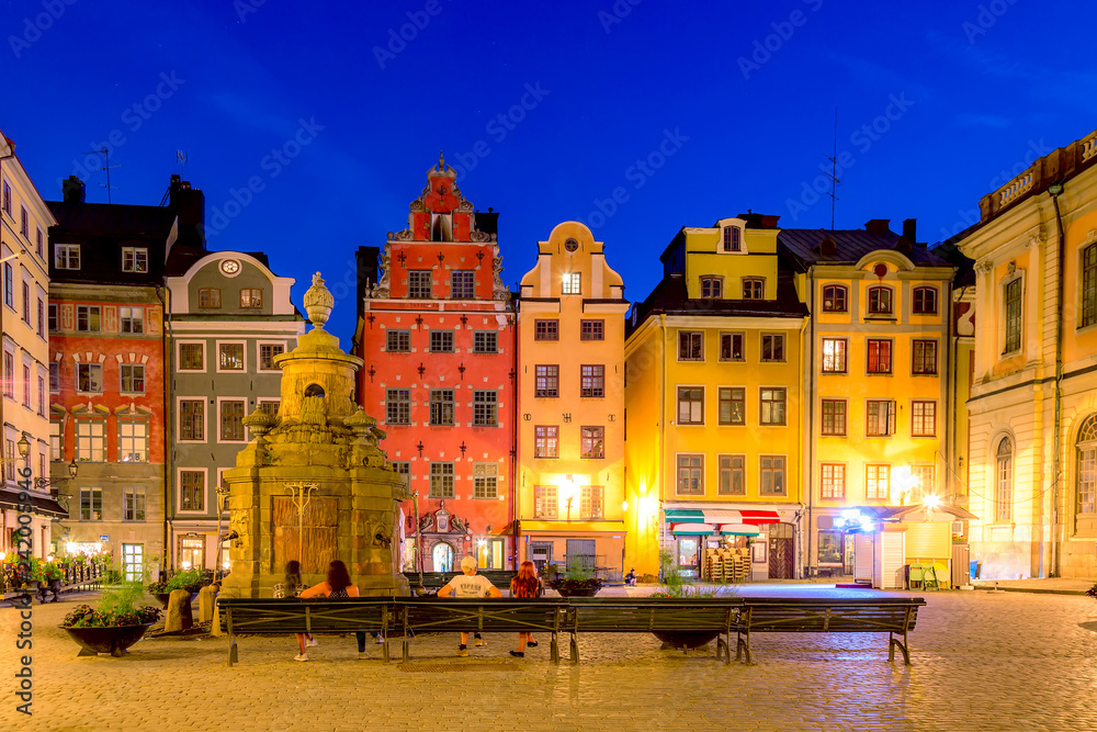 Colorful facade of the houses in Stortorget Square Gamla Stan. Stockholm, Sweden during twilight evening sunset.