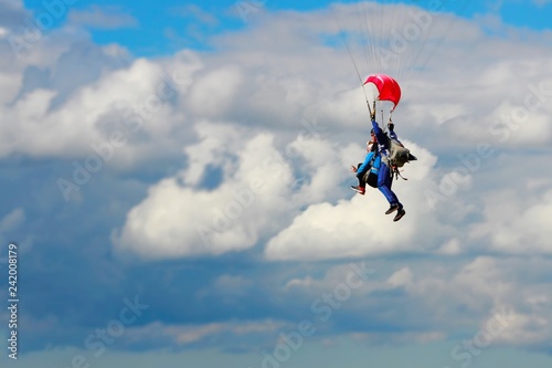 Skydiving in tke blue sky