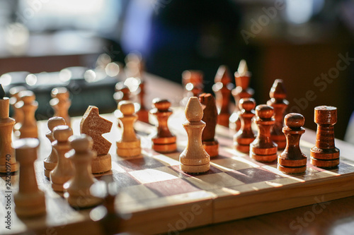 The figures are placed on a chessboard. Beginning of the game.