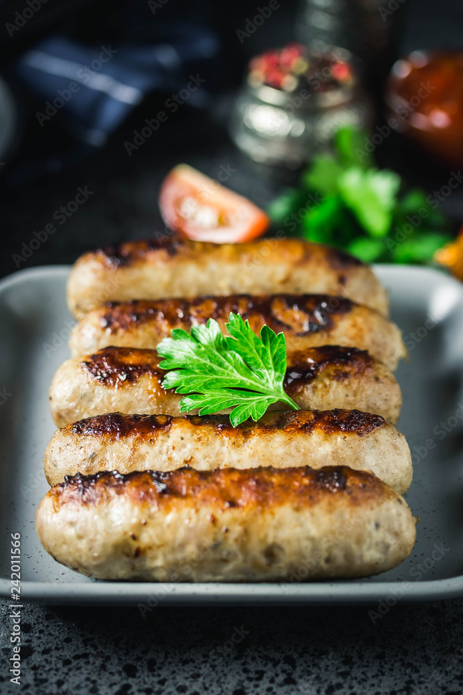 Grilled kebabs on dark background. Selective focus, space for text.