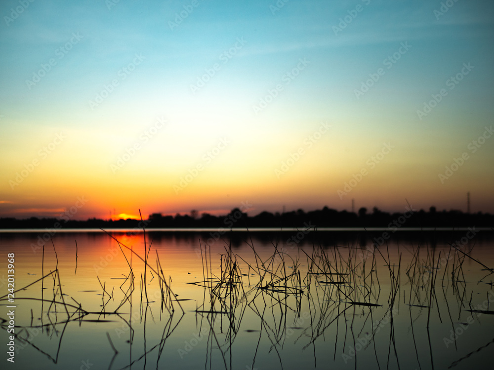 Sunset on the lake background.
