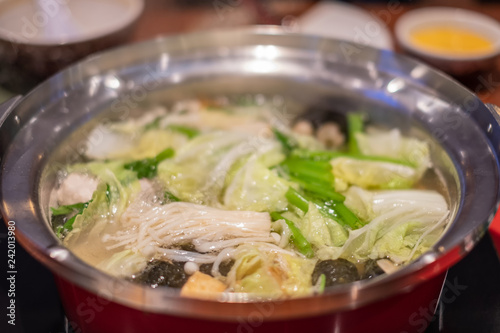 Suki Shabu in vegetable soup, a Japanese nabemono hotpot dish of thinly sliced meat and vegetables boiled in water photo