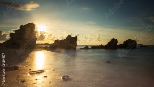 Sunrise seascape with natural stone arch © Blanscape