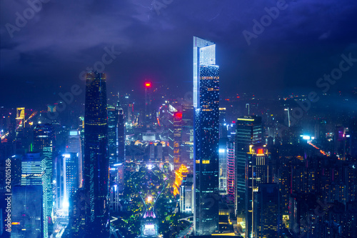 Night cityscape of guangzhou urban skyscrapers at storm with lightning  bolts in night purple blue sky  Guangzhou  China