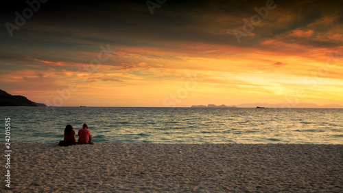 Couple enjoy sunrise seascape at Lipe
