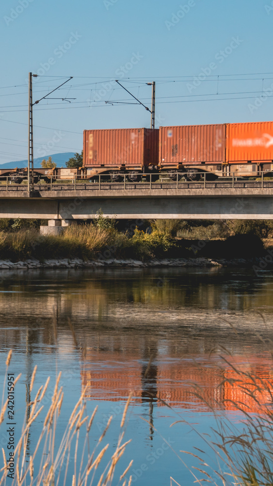 Smartphone HD wallpaper of beautiful reflections with driving train at the Isarbridge Plattling Smartphone HD wallpaper of beautiful reflections with driving train at the Isarbridge Plattling