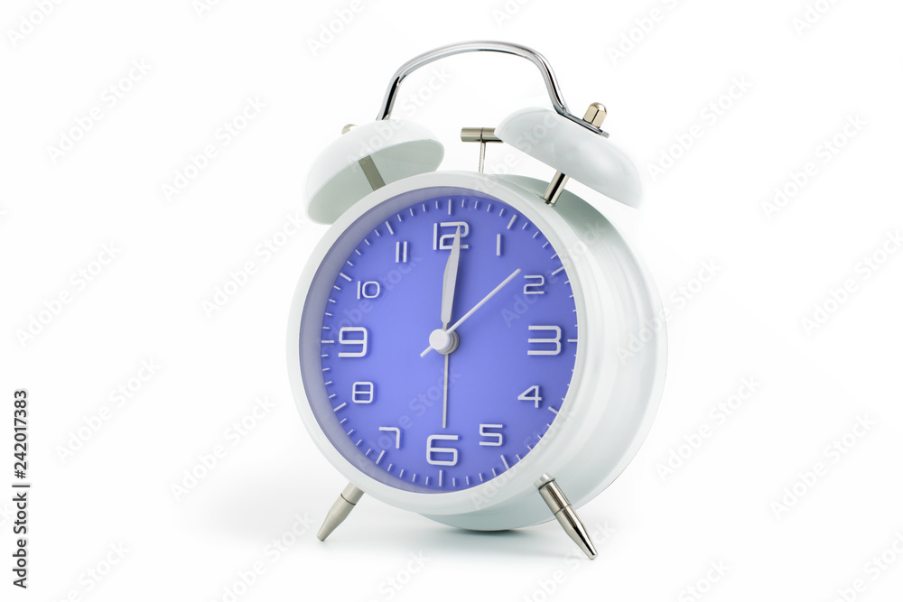 Twin bells analogue alarm clock with blue clock face shows 1 past 12, 12.01 AM PM; concept on white background Twin bells analogue alarm clock with blue clock face shows 1 past 12, 12.01 AM PM; concept on white background