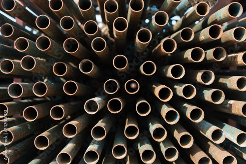 stack of metal pipes for scaffolding