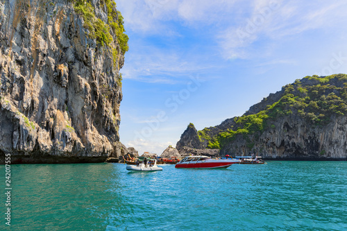 Boats in the sea near the island of Muk, is the famous Emerald Cave or Morakot Cave. Province Trang, south of Thailand photo