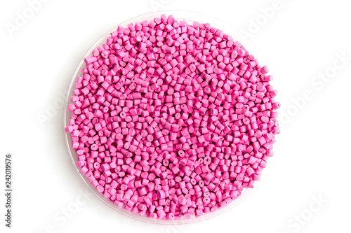 The plastic granules. Dye for polypropylene, polystyrene granules into a measuring container