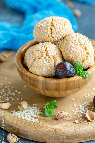 Homemade Moroccan sesame cookies in a wooden bowl.