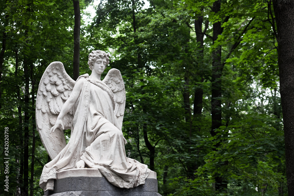 The tombstone of the 19th century-a grieving angel at the German cemetery reminds us of eternity.