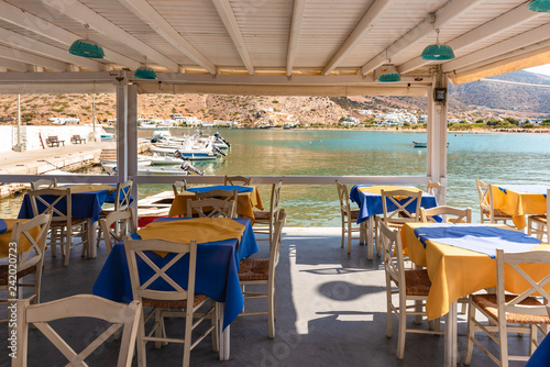 SIFNOS  GREECE - September 10  2018  Tables with chairs on coastal promenade. Sifnos island  Greece