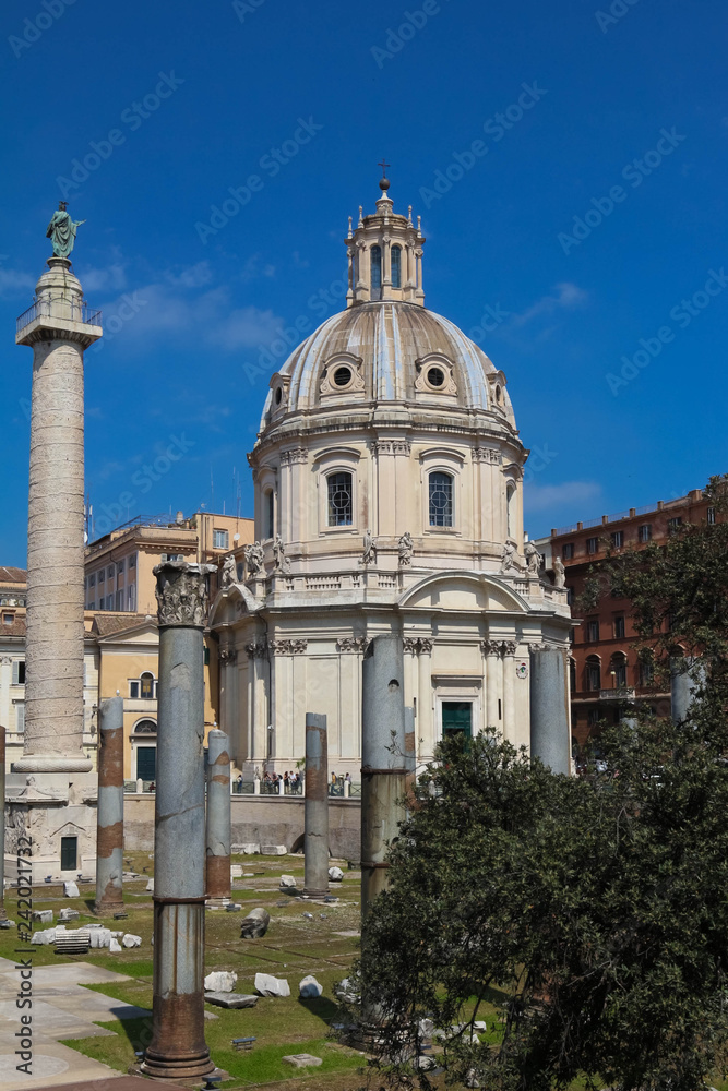 Trajan's Column and The Church of the Most Holy Name of Mary at the Trajan Forum, Rome, Italy.