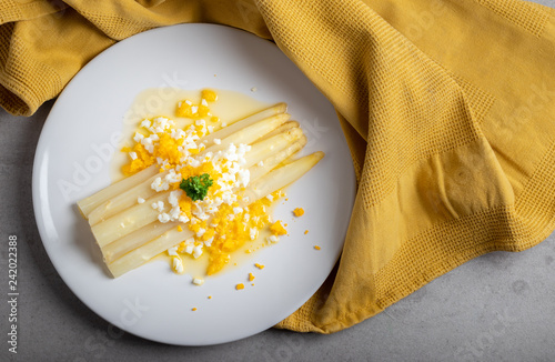 Fotografie, Obraz cooked white asparagus with butter and boiled eggs