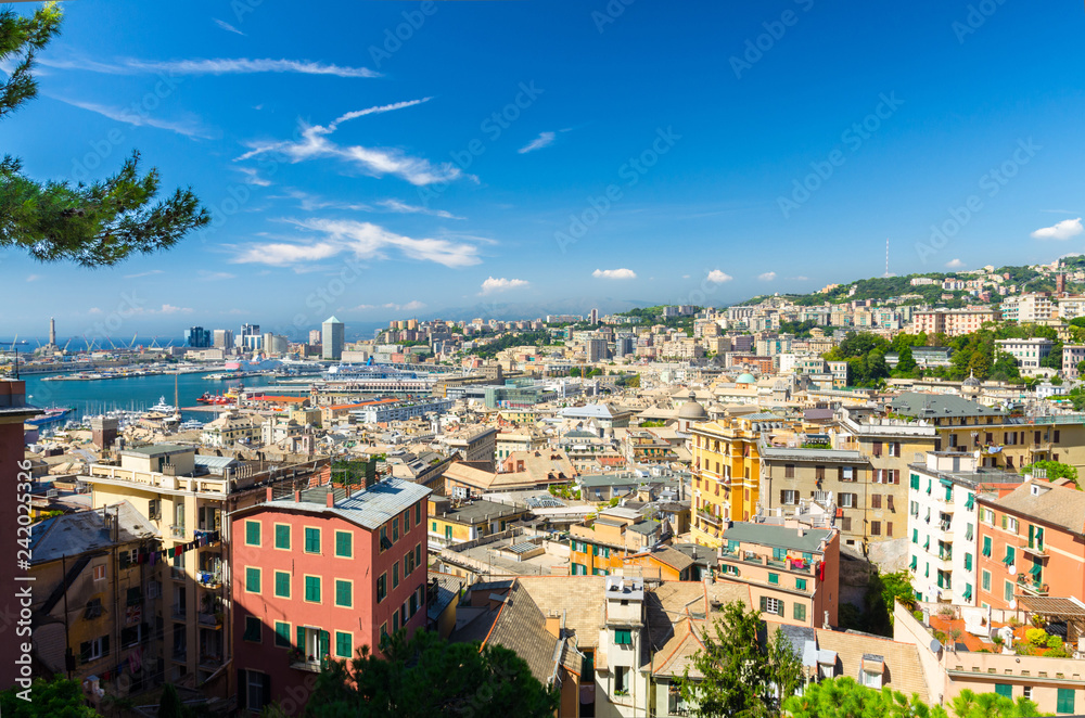 Top aerial scenic panoramic view from above of old historical centre quarter and modern districts of european city Genoa (Genova) and harbor of Ligurian and Mediterranean Sea, Liguria, Italy