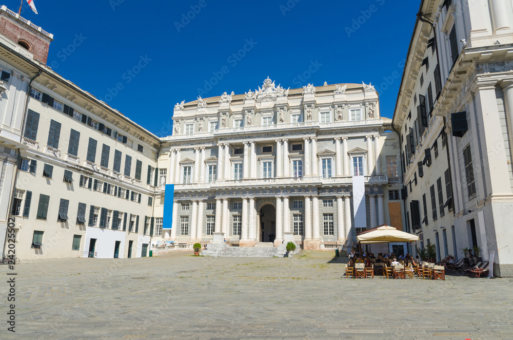 Doge's Palace Palazzo Ducale classic style building on Piazza Giacomo Matteotti square in historical centre of old european city Genoa (Genova) with blue sky background, Liguria, Italy