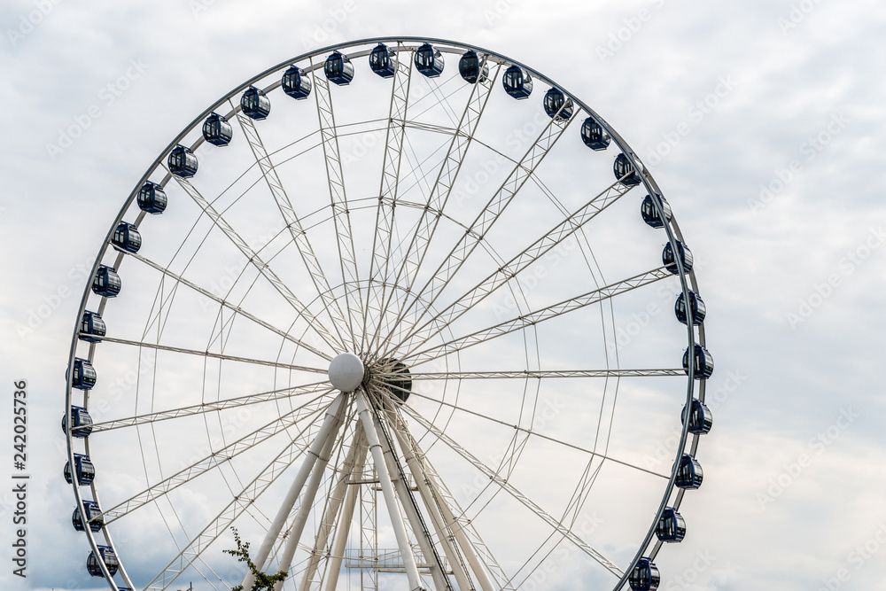 Ferris wheel under sky in cloud day Ferris wheel under sky in cloud day