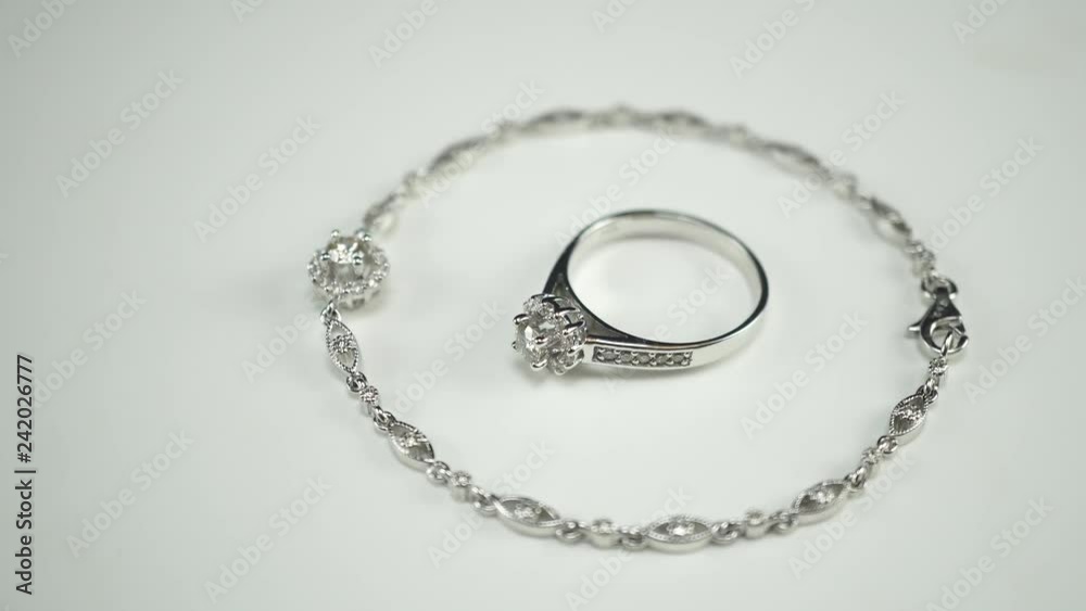 Bracelets and rings. Diamond jewelery products made of platinum. 4K Bracelets and rings. Diamond jewelery products made of platinum. 4K