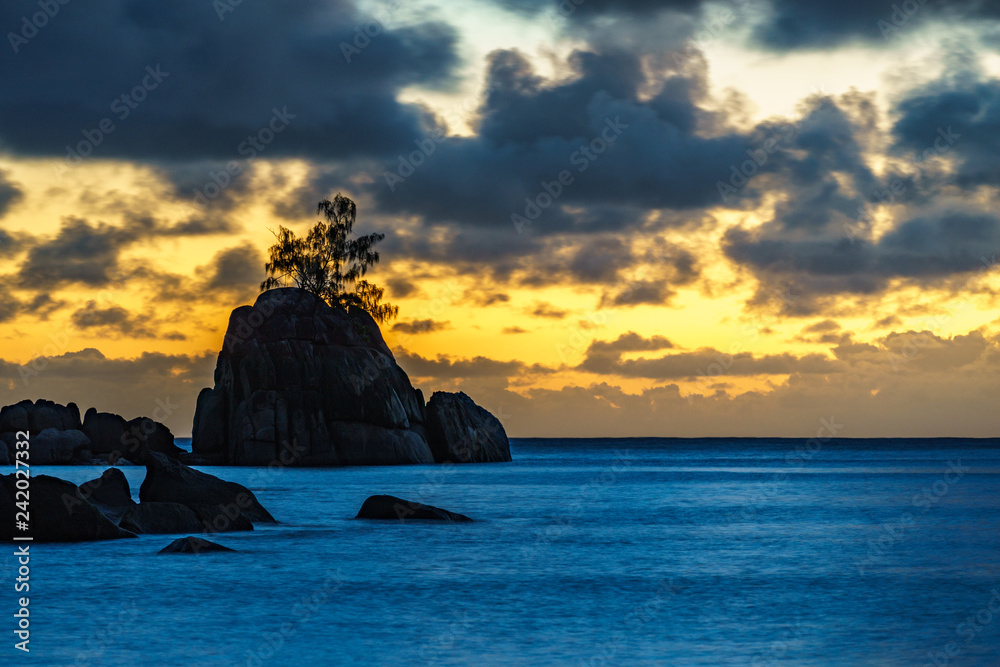 Mystic sunset over rock with single tree. seychelles 4