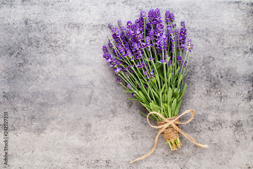 Fototapeta Naklejka Na Ścianę i Meble -  Lavender flowers, bouquet on rustic background, overhead.