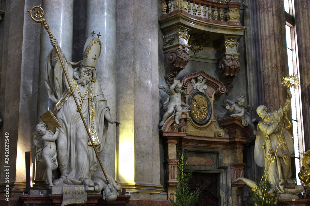 Prague / Czech Republic - January 31 / 218 : St. Cyril of Alexandria holding a crook towards a man and an angel is holding a book at St. Nicholas church