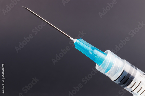 Close up view of a syringe with hypodermic needle. Opiate and heroin overdoses have skyrocketed in recent years I
