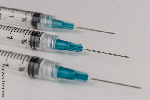 Close up view of a three syringes with hypodermic needles. Opiate and heroin overdoses have skyrocketed in recent years V