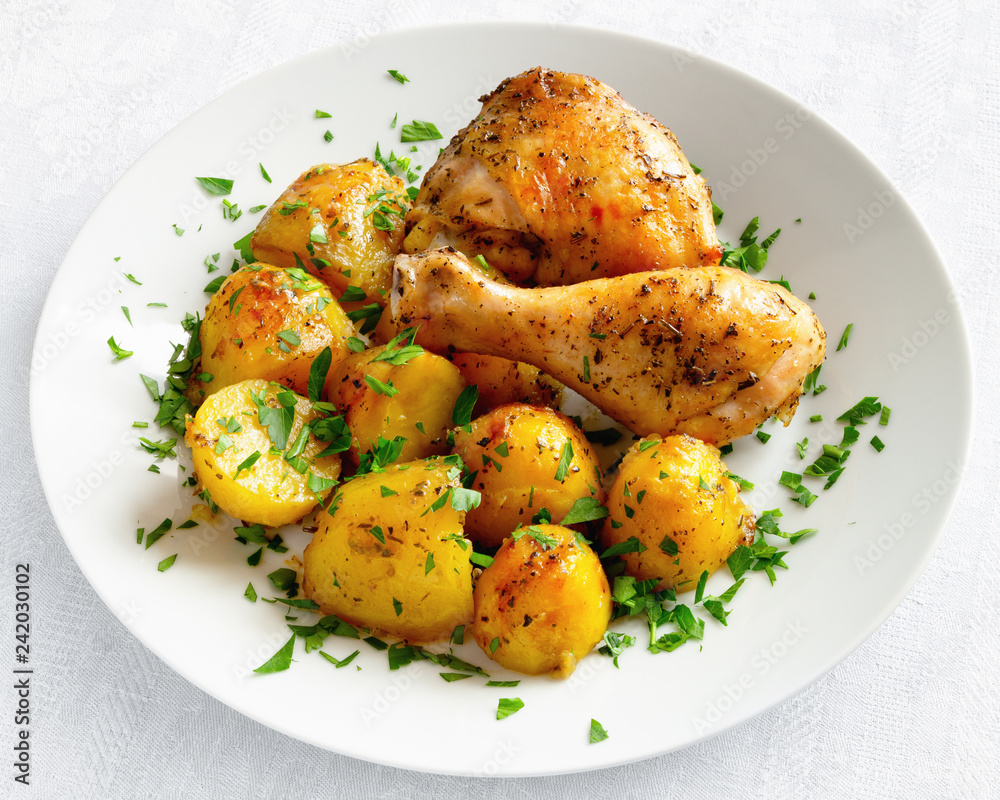 oven baked chicken and potato decorated with parsley oven baked chicken and potato decorated with parsley