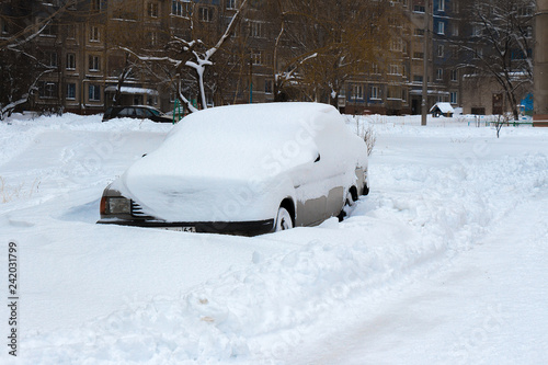 The car is covered with a thick layer of snow © Игорь Салов