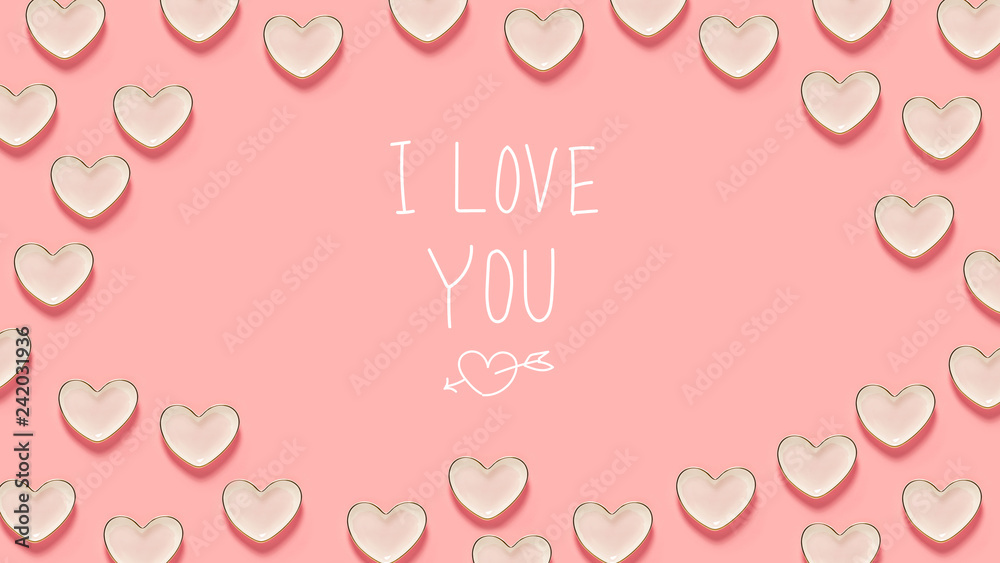 I Love You message with many heart dishes on a pink background