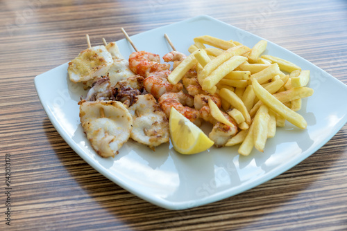 Fish skewers with fries