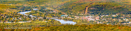 Aerial view of the City of Port Jervis, NY crossed by Upper Delaware river as viewed from High Point peak, NJ