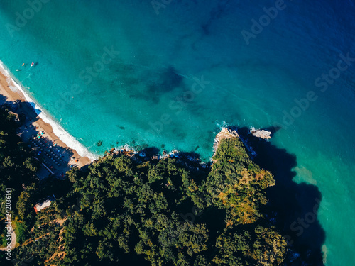 Drone top view of a sea cliff and a beach