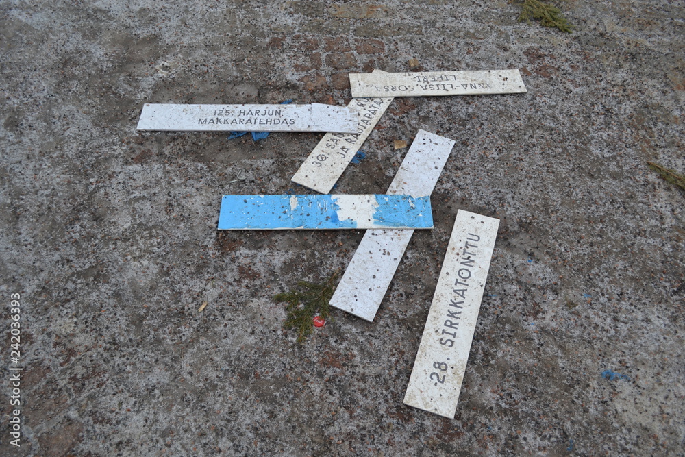 Plates with the name of the streets of Helsinki. Lie on the ground