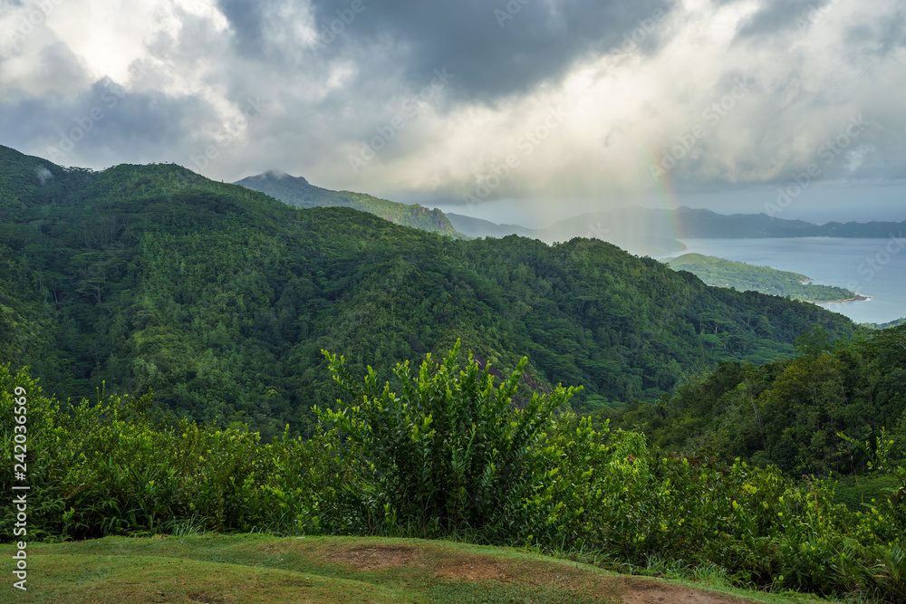 rainbow and rain over the jungle and mountains of mahé, seychelles 2
