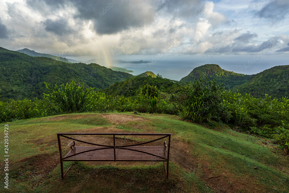 rainbow and rain over the jungle and mountains of mahé, seychelles 6