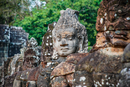 Intricately sculpted heads in the temples of Angkor Wat