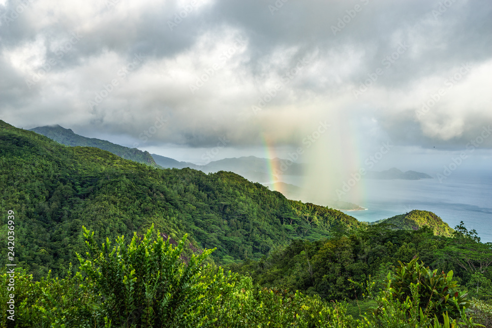 rainbow and rain over the jungle and mountains of mahé, seychelles 14