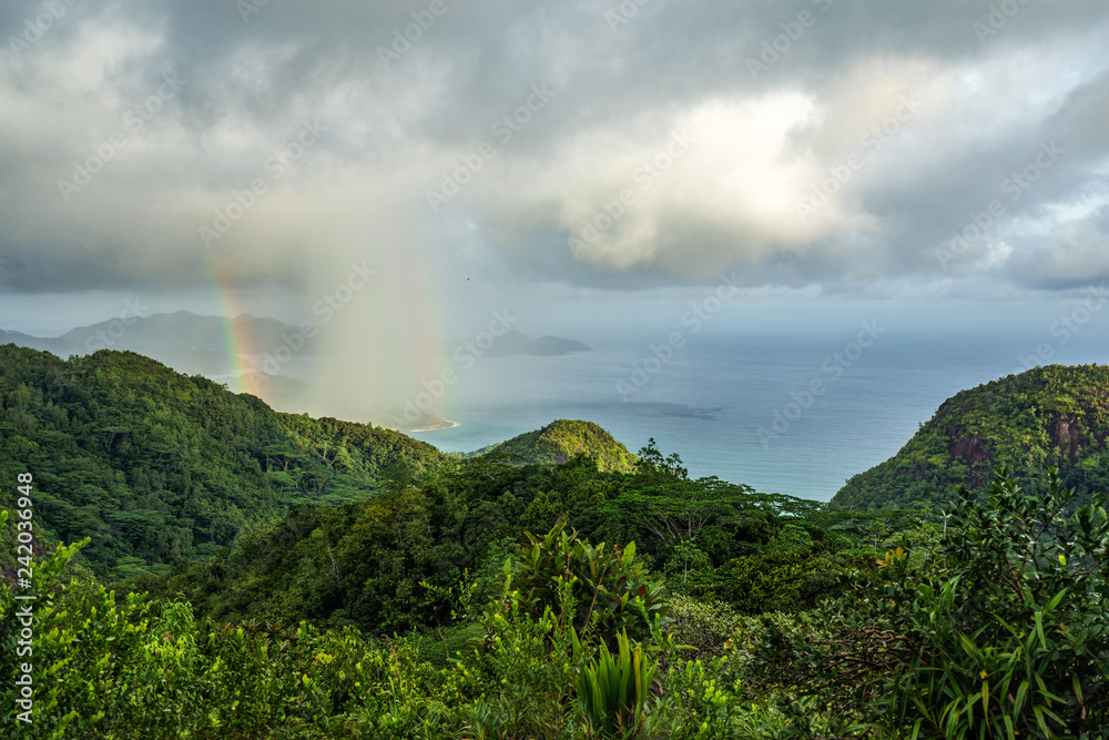 rainbow and rain over the jungle and mountains of mahé, seychelles 15